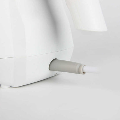Steam cleaner in use on fabric